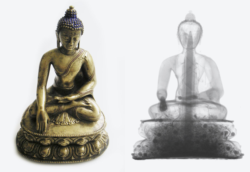 Neutron research in the service of archaeology: Tibetan Buddha statue made of brass (15th century). Photograph and a neutron radiogram. The radiogram reveals wooden objects and dried flowers hidden inside the statue. The statue remained completely undamaged during the investigation. Neutrons easily pass through metals and reveal substances containing hydrogen.