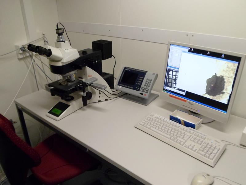 Optical microscope with position encoders and attached camera and PC.
