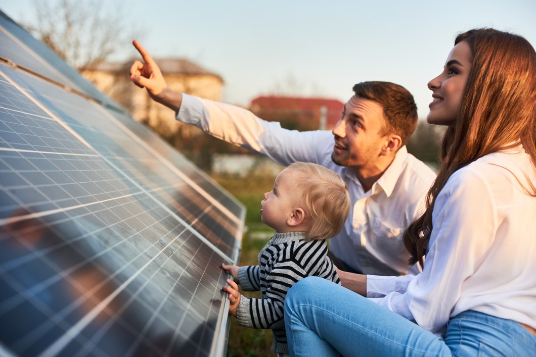 parents_with_child_and_solar_panels