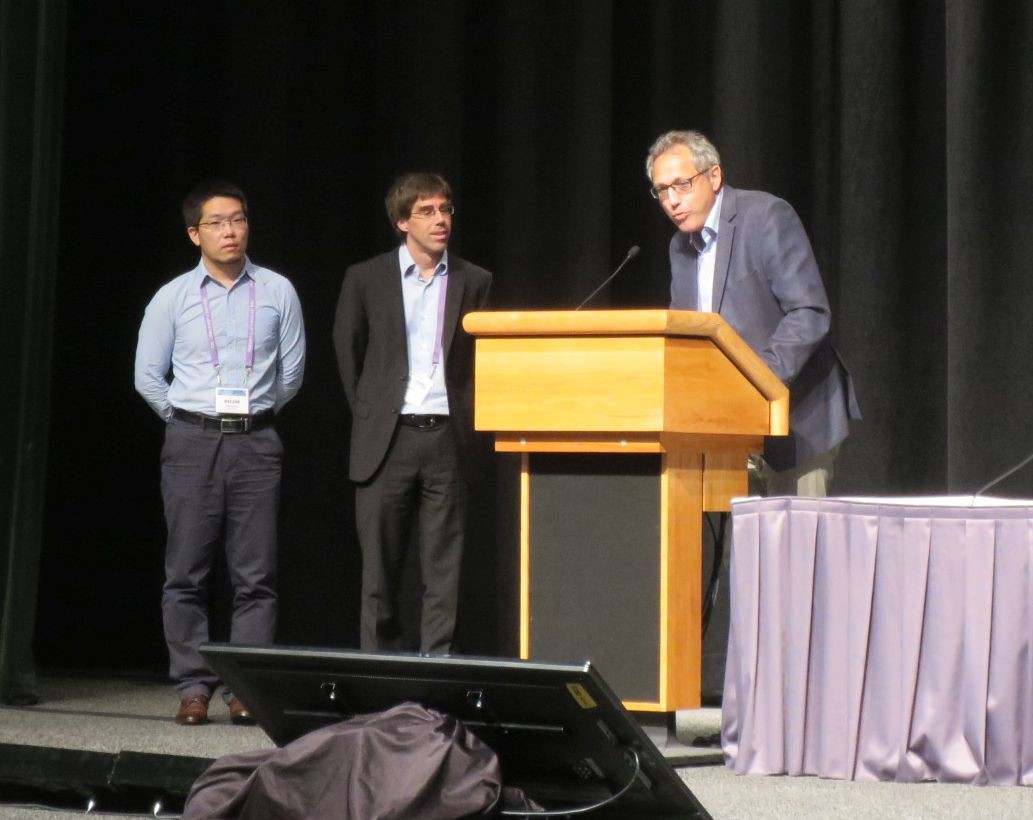 Ru-Jin Huang (left) and Jay Slowik (center) during the award ceremony