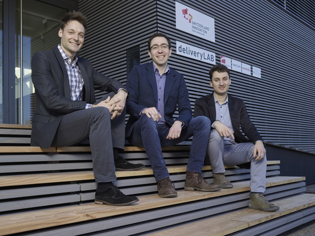 The InterAx Biotech team: Luca Zenone, Martin Ostermaier, and Aurélien Rizk in front of the PARK INNOVAARE pavilion. (Photo: Scanderbeg Sauer Photography)
