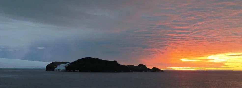 Siple Bay at sunset with falling ice-crystals