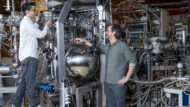 Yong Hu and Nicholas Clark Plumb at the SIS beamline