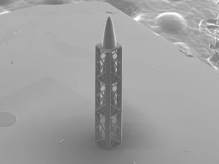 Microstructure from the 3D printer: the refractive structure, together with a diffractive part, produces an achromatic X-ray lens and, when upright, resembles a tiny rocket.