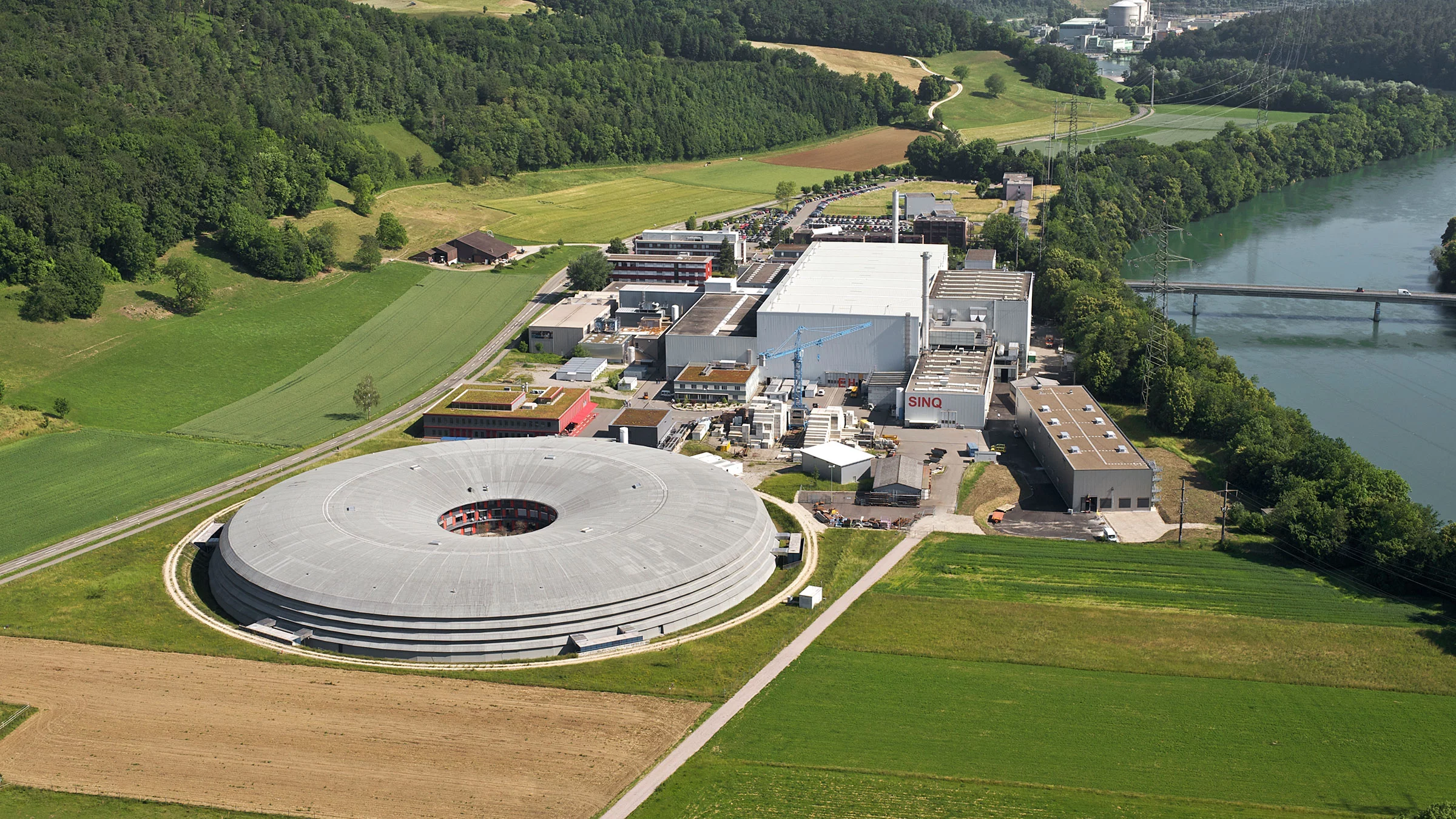 Aerial photograph of the Paul Scherrer Institute (western area) taken in June 2009 with the SLS in the foreground.