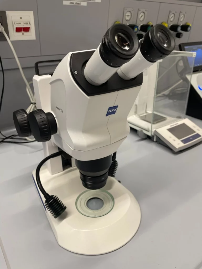 A light microscope on a lab bench