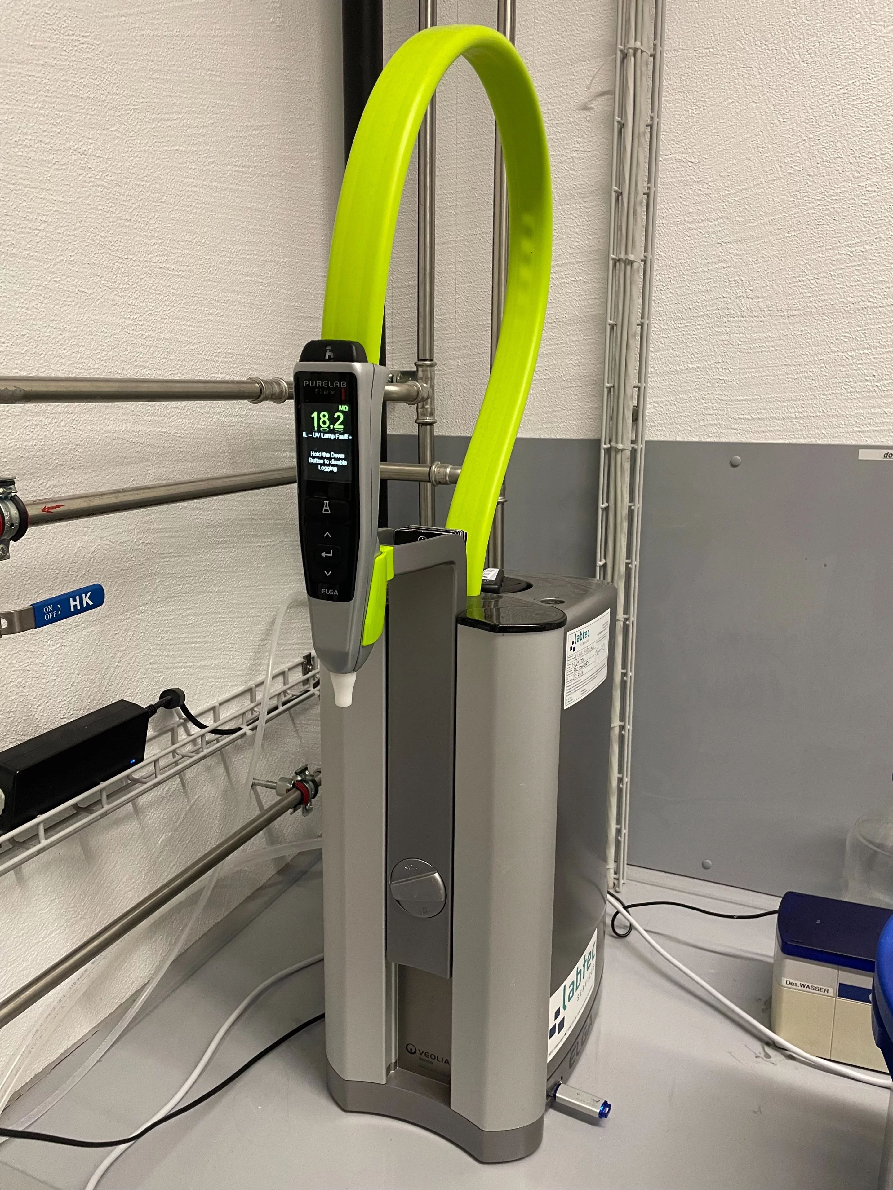 Silver box with green tubing and a digital screen