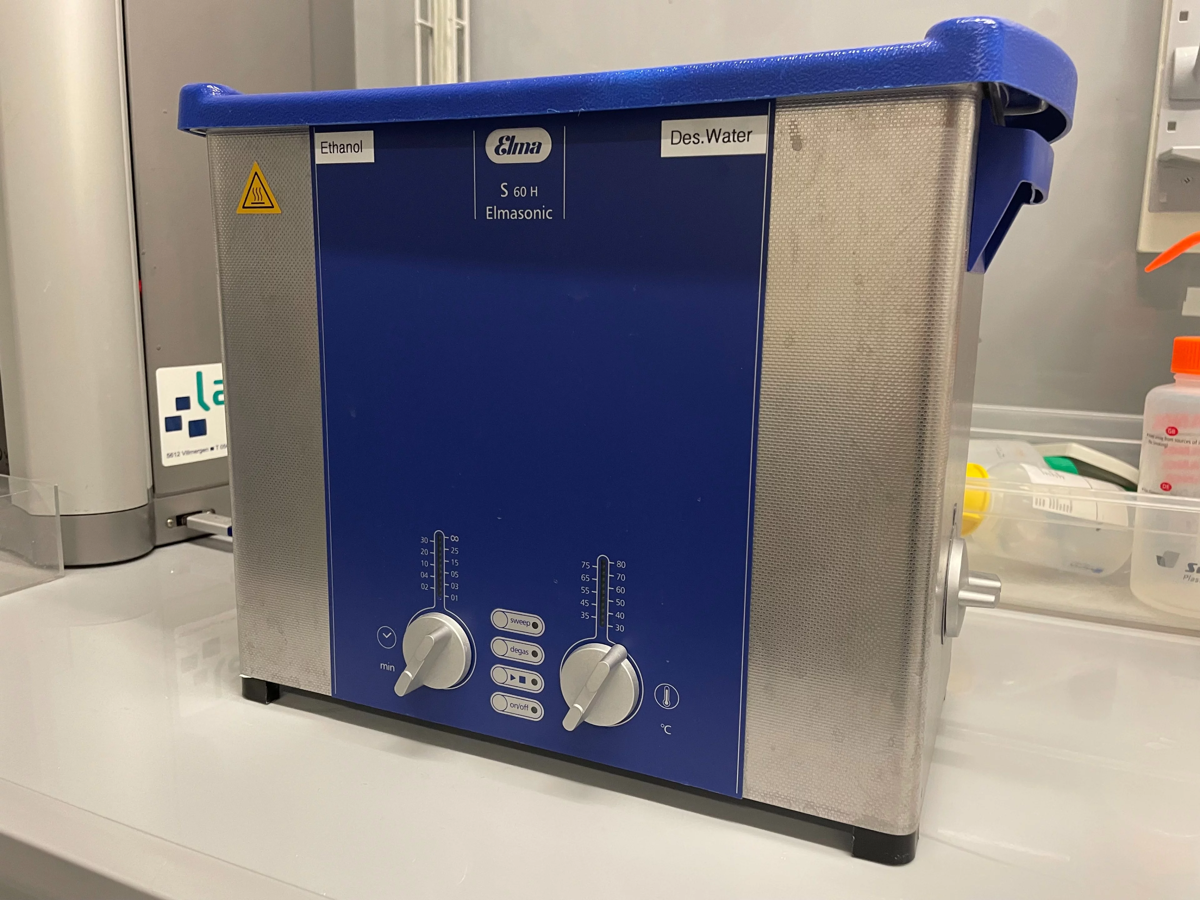 Small metal box with blue plastic lid