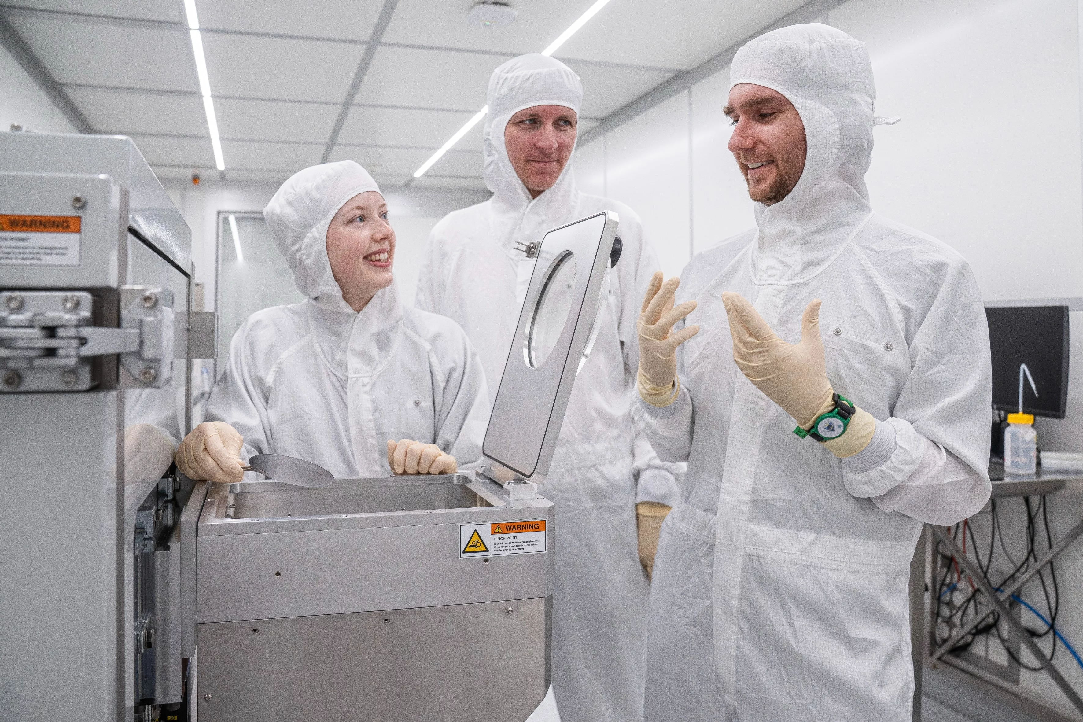 Lauren Riddiford, Aleš Hrabec, and Jeffrey Brock (from left to right) in the cleanroom at Park Innovaare