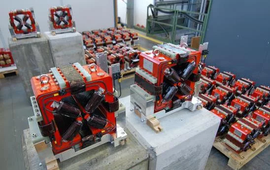Figure 1: 22 mm aperture quadrupoles with their integrated dipole corrector coils in the assembly area of ATK before the magnetic tests.