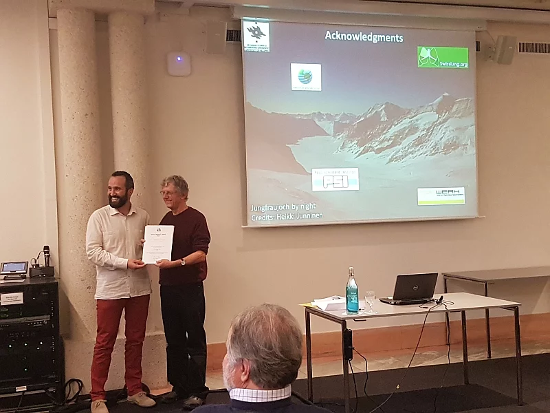 Federico Bianchi (left) receives the award