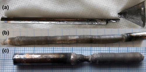 Photos of (a) the cast CeAlGe rod, and the floating-zone-grown crystals of (b) CeAlGe and (c) PrAlGe.