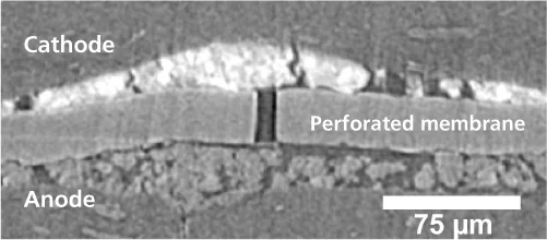 The membrane as prepared for the experiments, with a hole drilled by ion beam milling (at the centre of the picture)