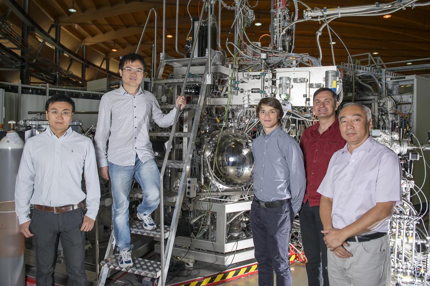 Members of the team from PSI that has just discovered the Weyl fermion. From left to right: Xu Nan, Lyu Baiqing, Christian Matt, Vladimir Strokov and Ming Shi (study head). (Photo: Paul Scherrer Institute/Mahir Dzambegovic)
