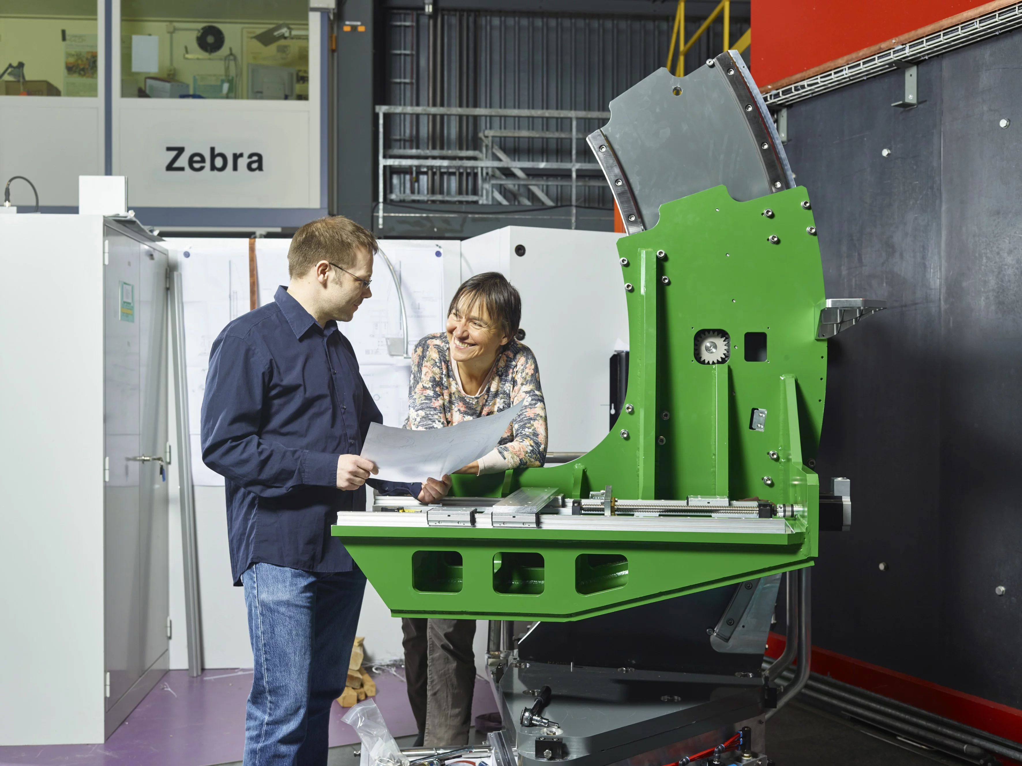 At the building site of the new neutron instrument Zebra: Oksana Zaharko, scientific manager of the project, and Matti Forster, technical manager. (Photo: Scanderbeg Sauer Photography)