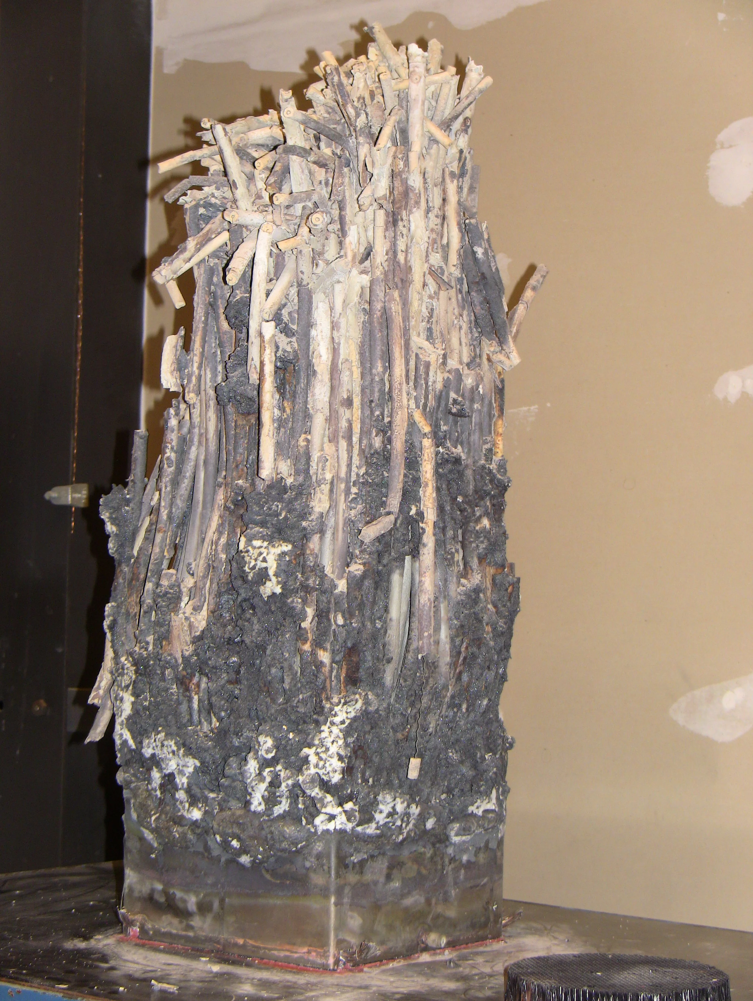 Remnant of SFP phase I spent fuel element after the ignition test under air environment.