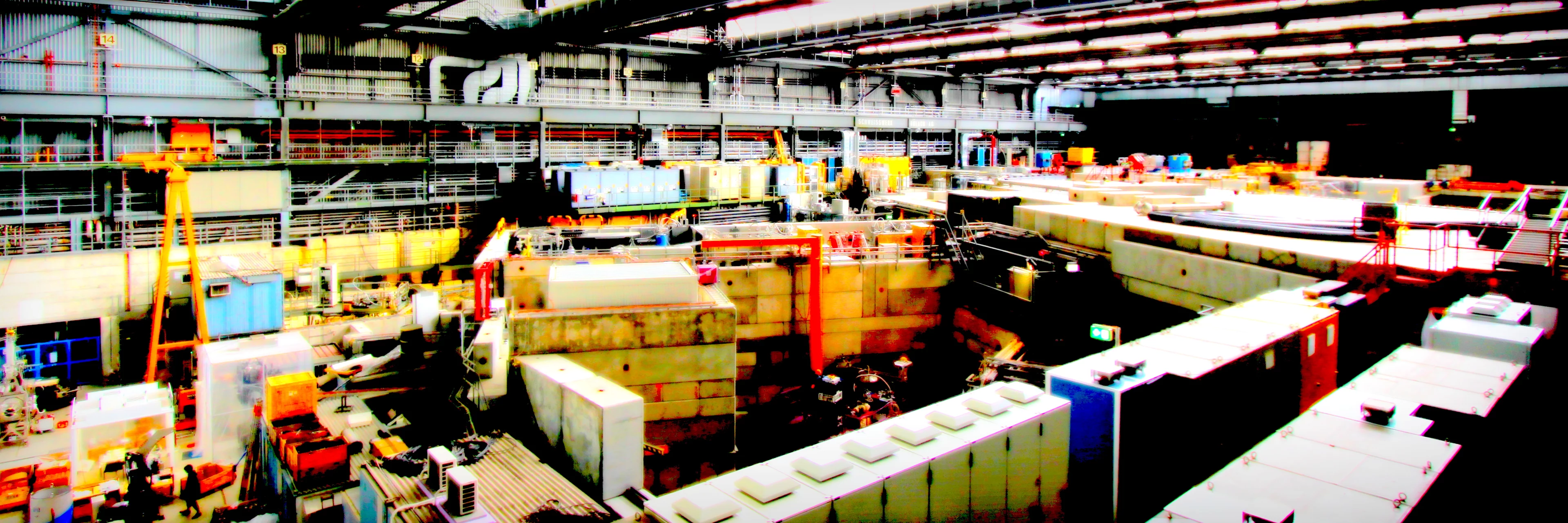 View of the PSI experimental hall with the secondary beam lines for pions and muons