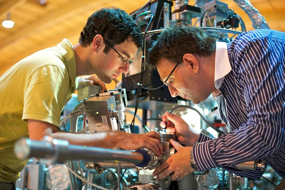 Brookhaven’s Mark Dean and PSI’s Thorsten Schmitt at the ADRESS beamline at the Swiss Light Source. (Photo: PSI / M. Fischer)