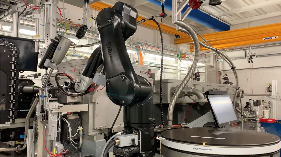 The black robotic gripper arm