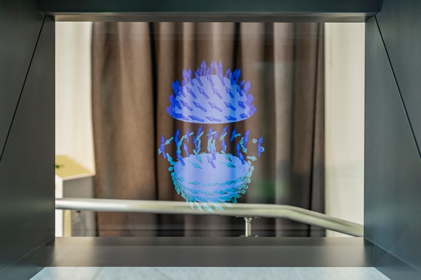 Nano-vortices as bits of the future: conventional data storage will reach its technical limits before long. PSI researchers are searching for new options. One very promising candidate is skyrmions. In the new exhibition they are presented as a hologram that will captivate visitors. 