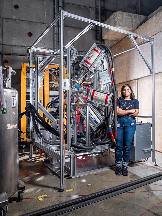 Sayani Biswas in front of the experimental station at PSI.