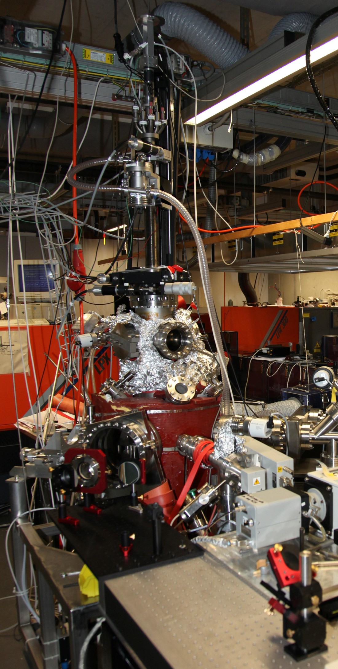 UHV PLD chamber for mass spectrometry and optical spectroscopy