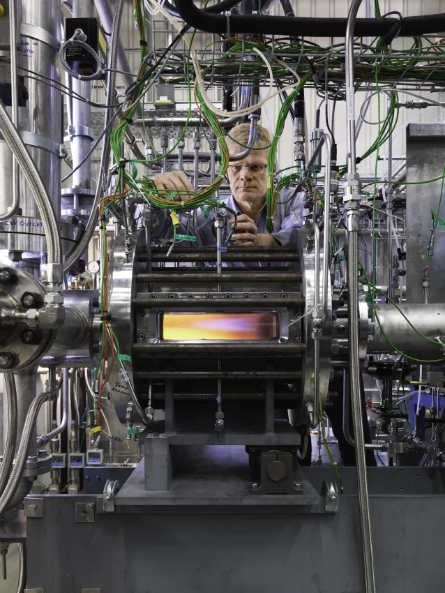Peter Jansohn, Head of the Combustion Research Laboratory, working at the research combustion chamber built by his team.(Source: Scanderbeg Sauer Photography)