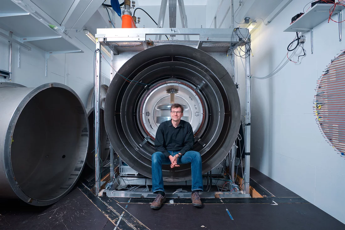 Klaus Kirch, head of the Laboratory for Particle Physics at the Paul Scherrer Institute PSI and professor at ETH Zurich, in front of the centrepiece of the experiment to determine the electric dipole moment of the neutron at PSI. (Photo: Paul Scherrer Institute/Markus Fischer)