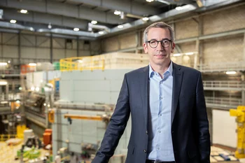 Christian Rüegg in front of PSI’s spallation neutron source SINQ