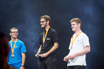 Melvin Deubelbeiss (centre) during the award ceremony. He emerged the clear winner with 58.32 points. 