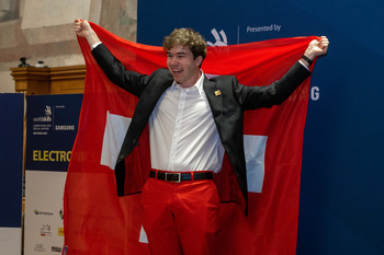 … and during the closing ceremony as a beaming silver medal winner.