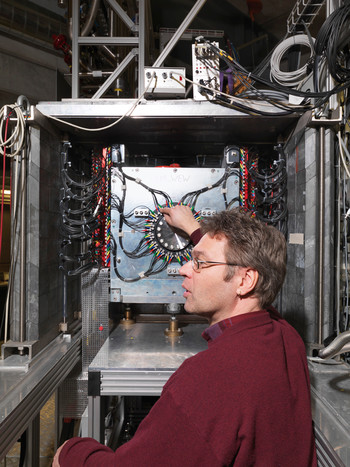 Thomas Prokscha at the experiment to study matter using slow muons.  The photograph shows the detector in which particles from muon decay are detected. (Photo Scanderbeg Sauer Photography)