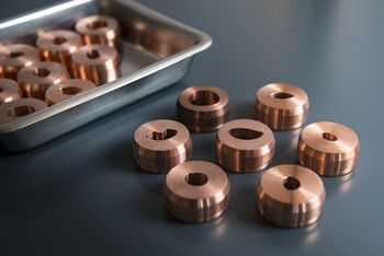 The copper aperture plates, also called collimators, are individually made for each patient and correspond to the shape of the tumour. They confine the proton beam so that it hits only the malignant tissue. (Photo: Paul Scherrer Institute/Mahir Dzambegovic)