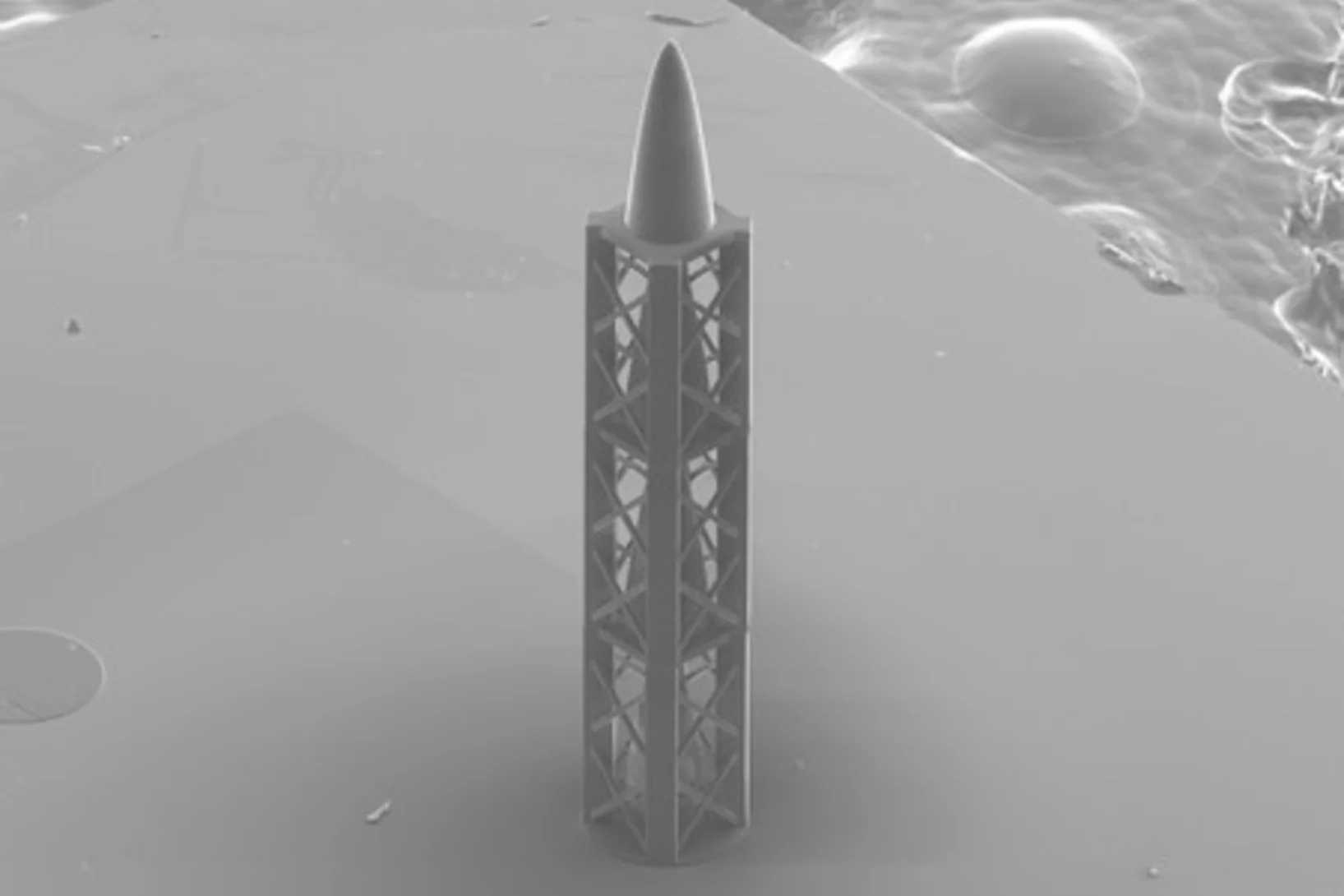 Microstructure from the 3D printer: the refractive structure, together with a diffractive part, produces an achromatic X-ray lens and, when upright, resembles a tiny rocket.