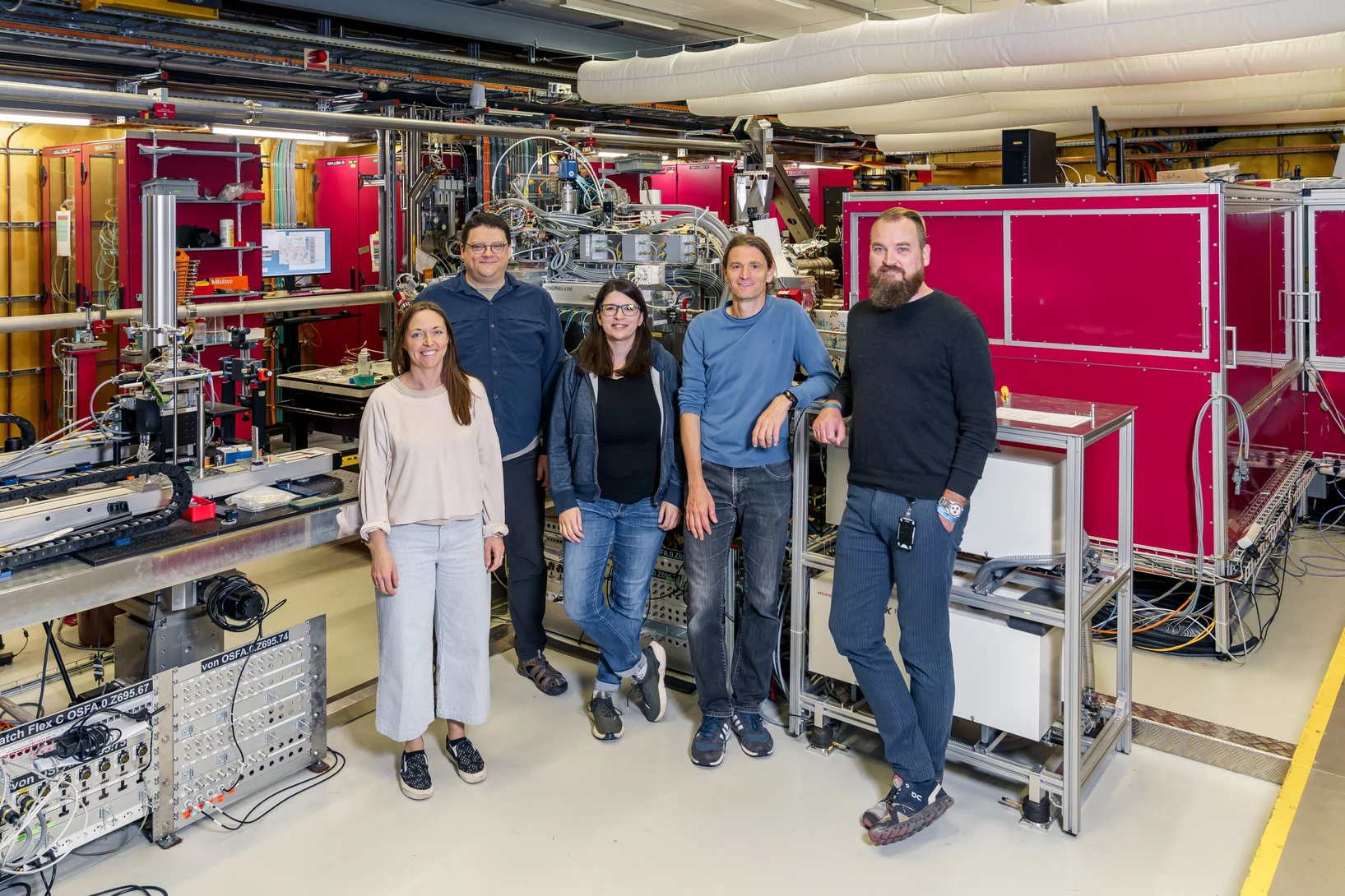 The Alvra Group members standing in the Experimental Hutch