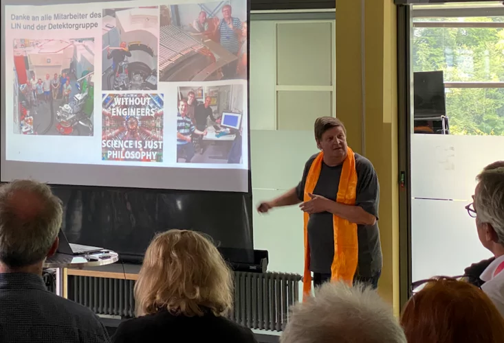 Christof walking people through his career at his retirement party